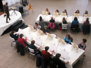 Our artist instructor leads a painting and wine class